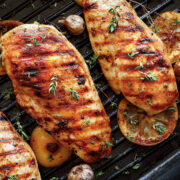 top view of two grilled lemon chicken breasts