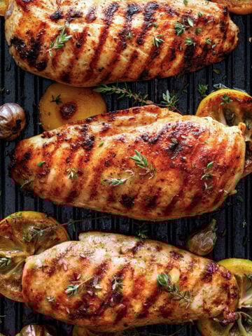 top view of three grilled lemon chicken breasts