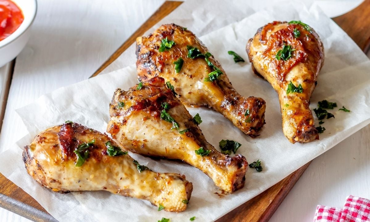 four baked chicken drumsticks