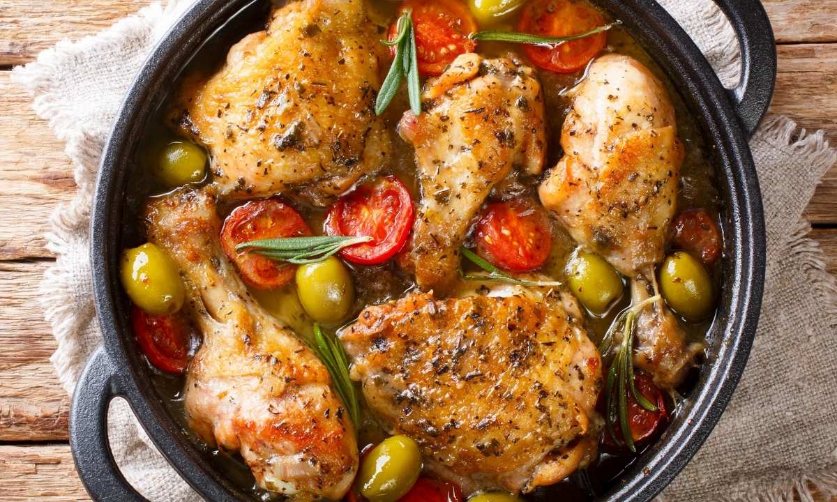 top view of basque chicken pieces in a skillet