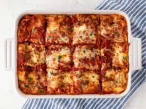 baked lasagna in a white baking dish