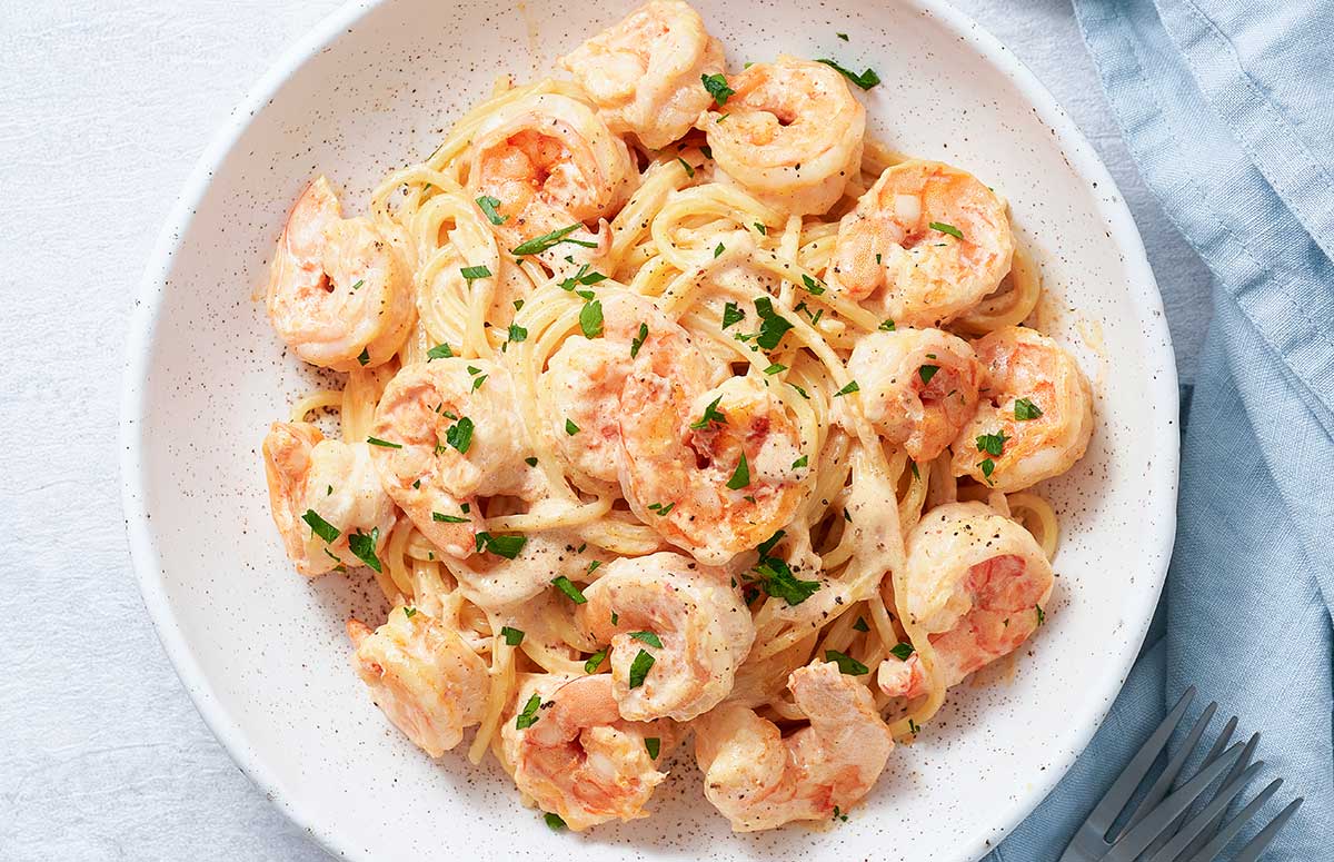 top view of a white dish with cajun shrimp pasta