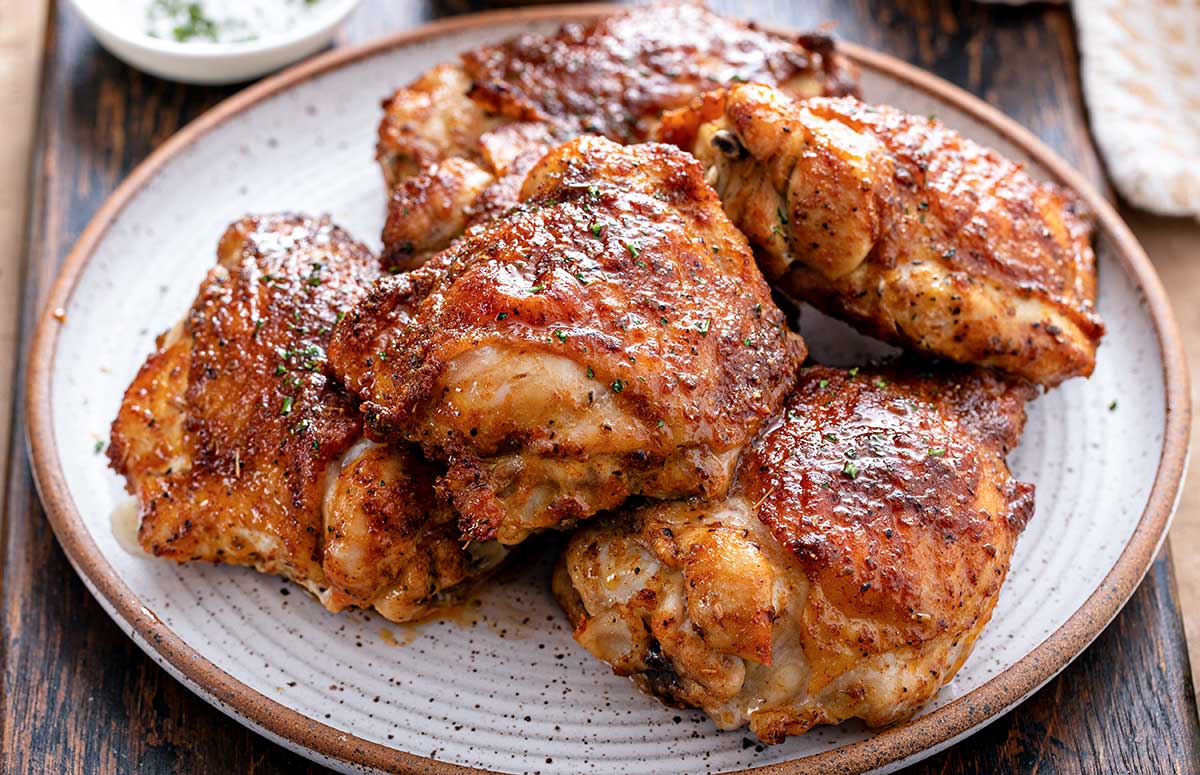 a plate with cumin chicken thighs