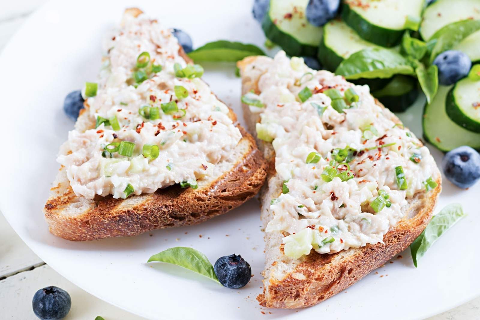 two pieces of toast with cottage cheese chicken salad
