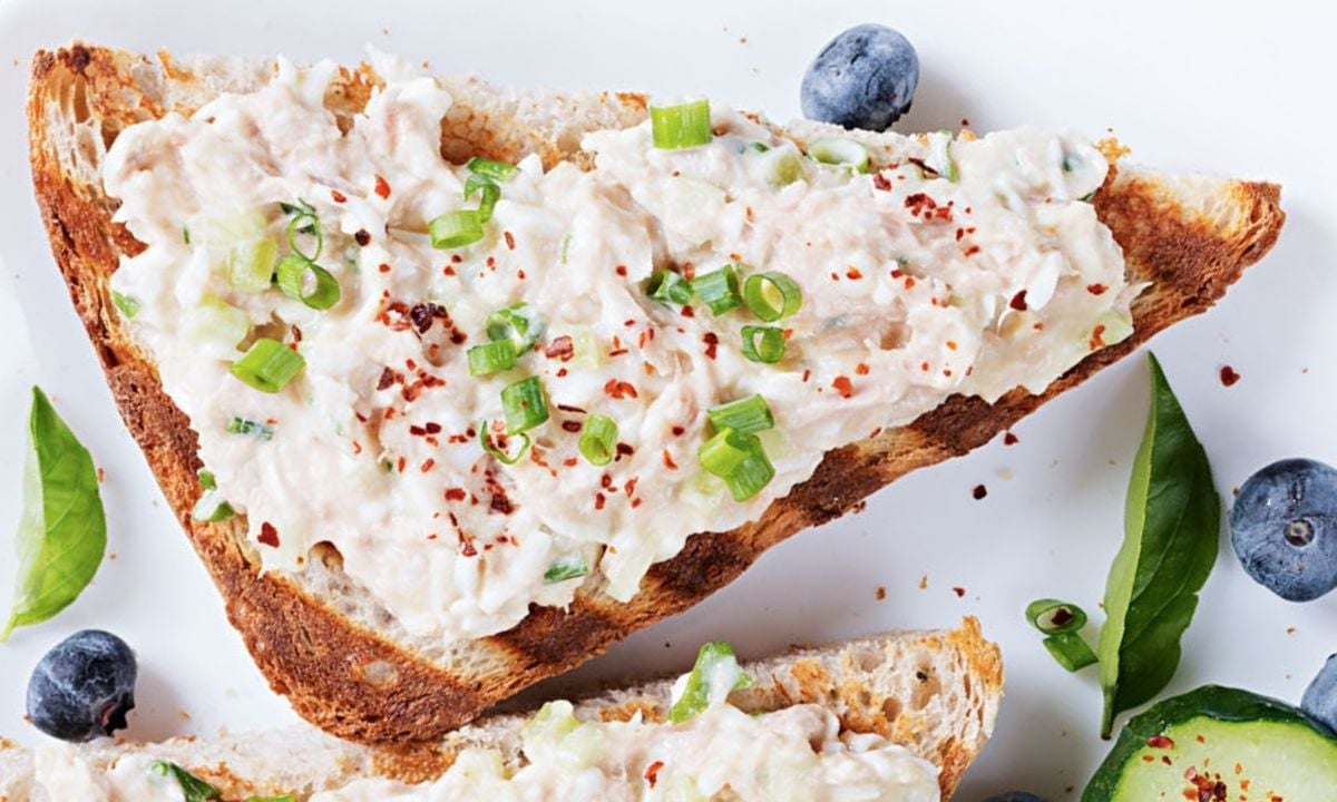 a piece of toast with cottage cheese chicken salad