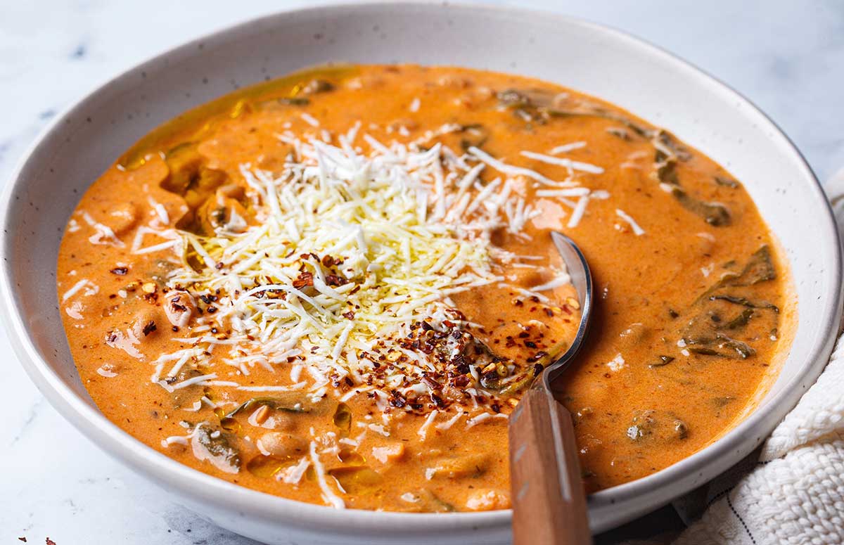a bowl of cottage cheese tomato soup with beans