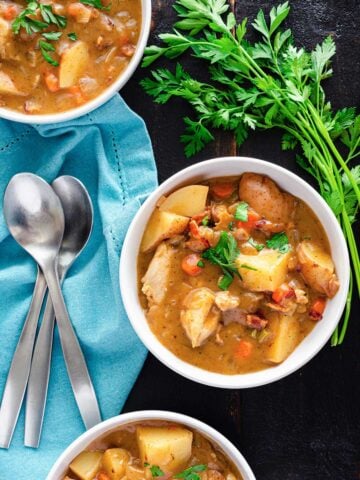 top view of three bowls with chicken stew