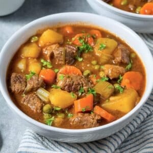 a bowl of beef stew with potatoes and carrots