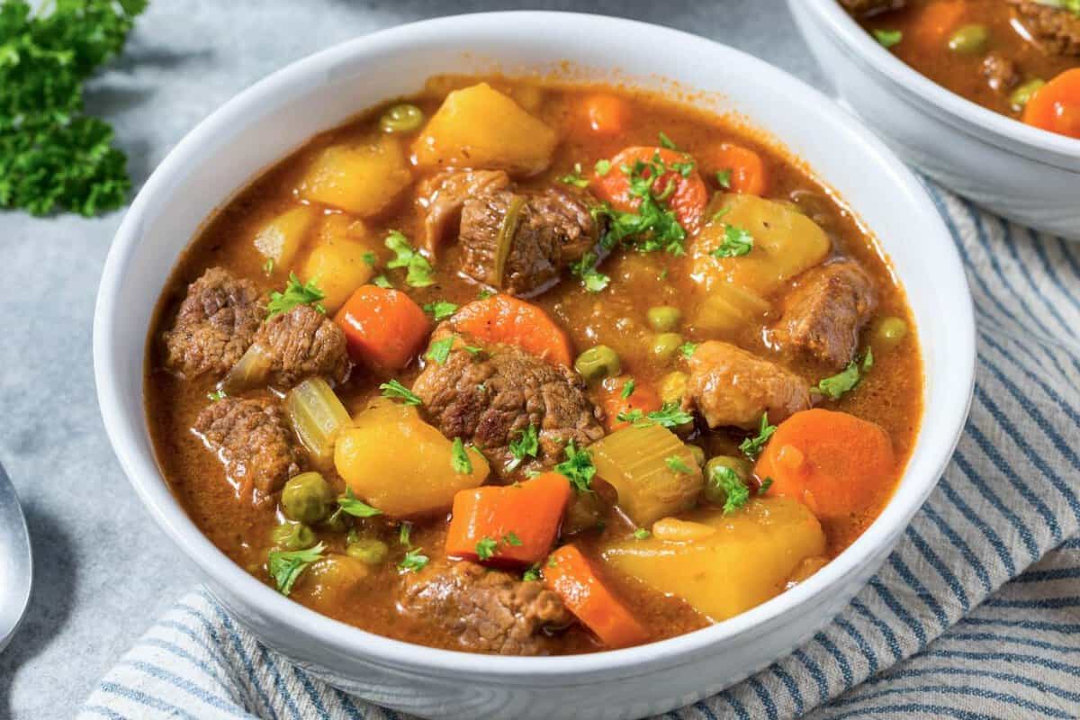 a bowl of beef stew with potatoes and carrots