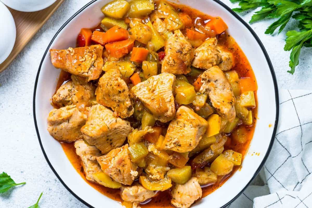 overhead view of a bowl of zucchini chicken stew