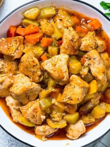 overhead view of a bowl of zucchini chicken stew
