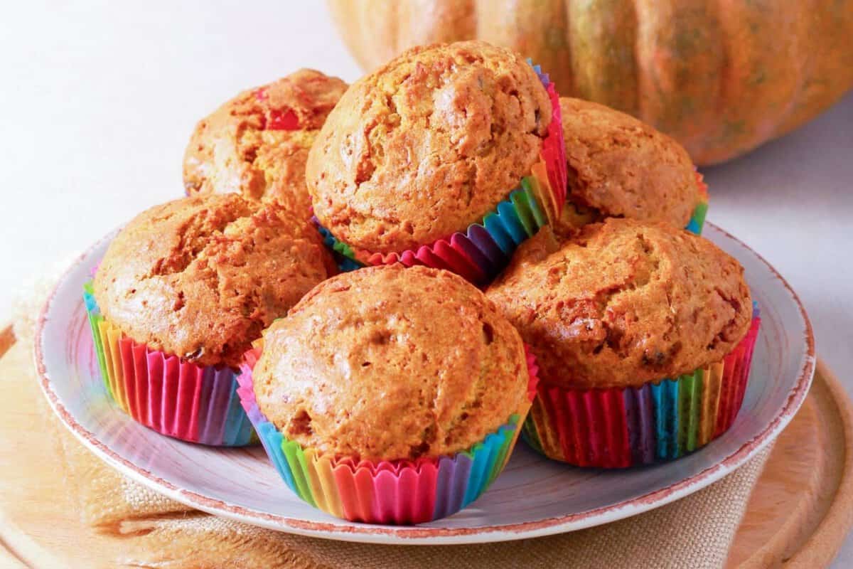 six pumpkin cottage cheese muffins in a white dish