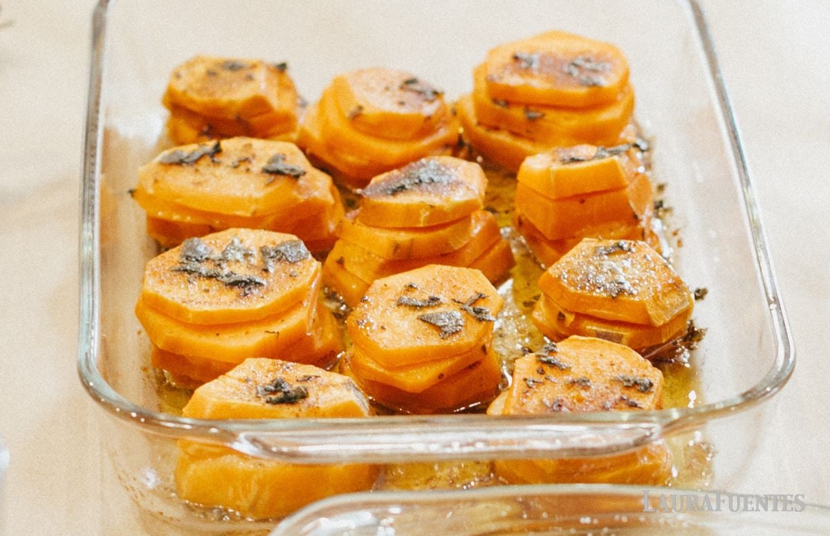 a baking dish with sweet potato stacks