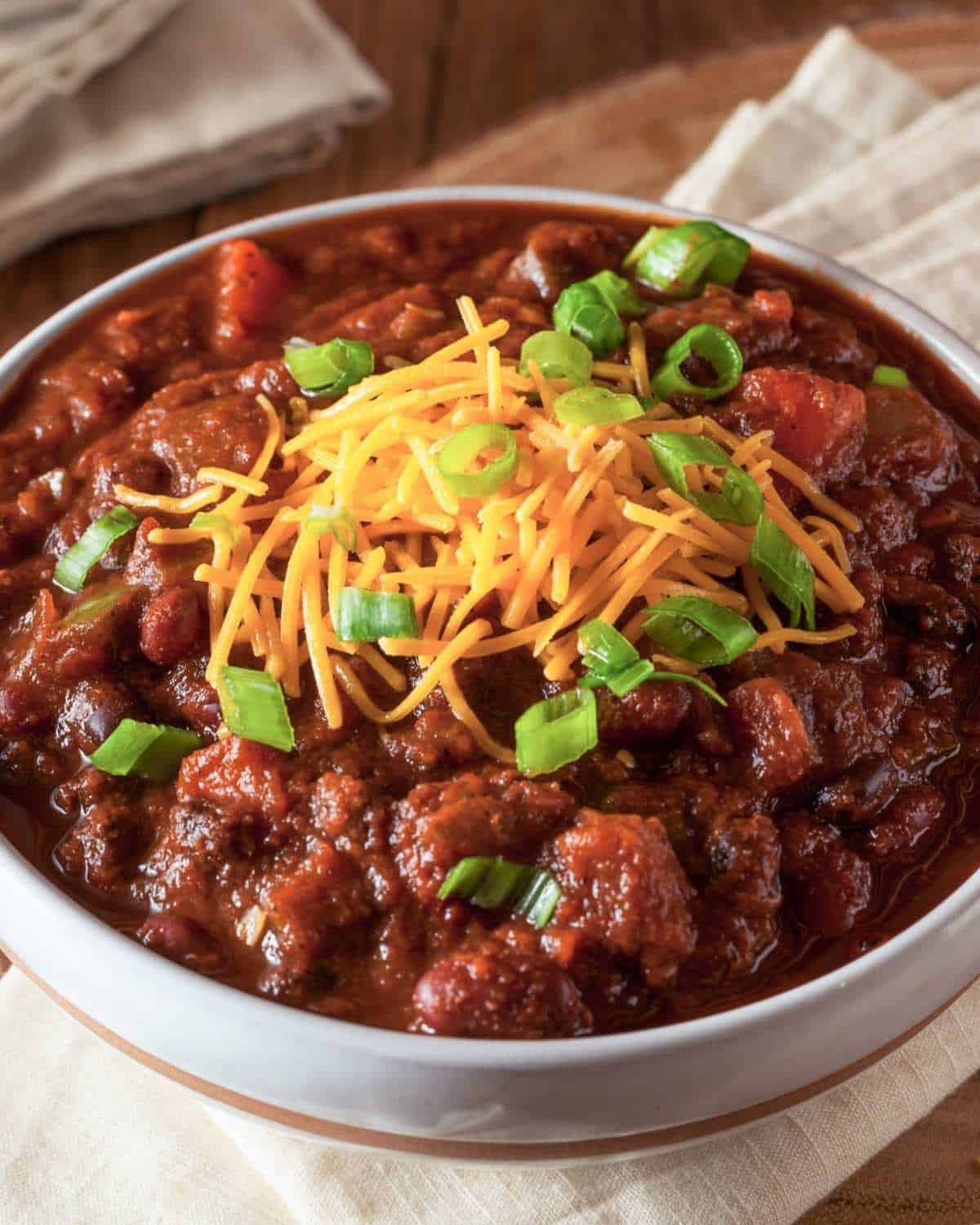 beef chili topped with cheese and chives