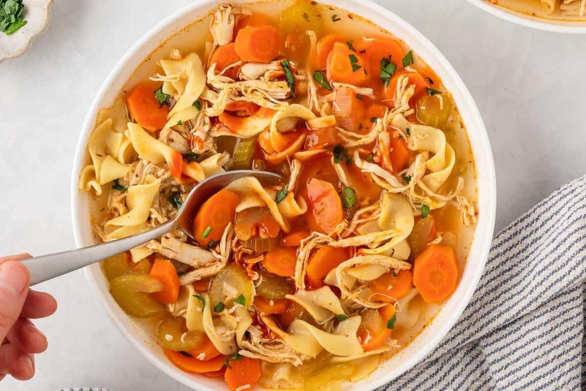 a bowl of spicy chicken noodle soup
