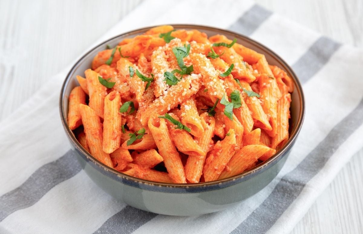 a bowl of spicy penne pasta