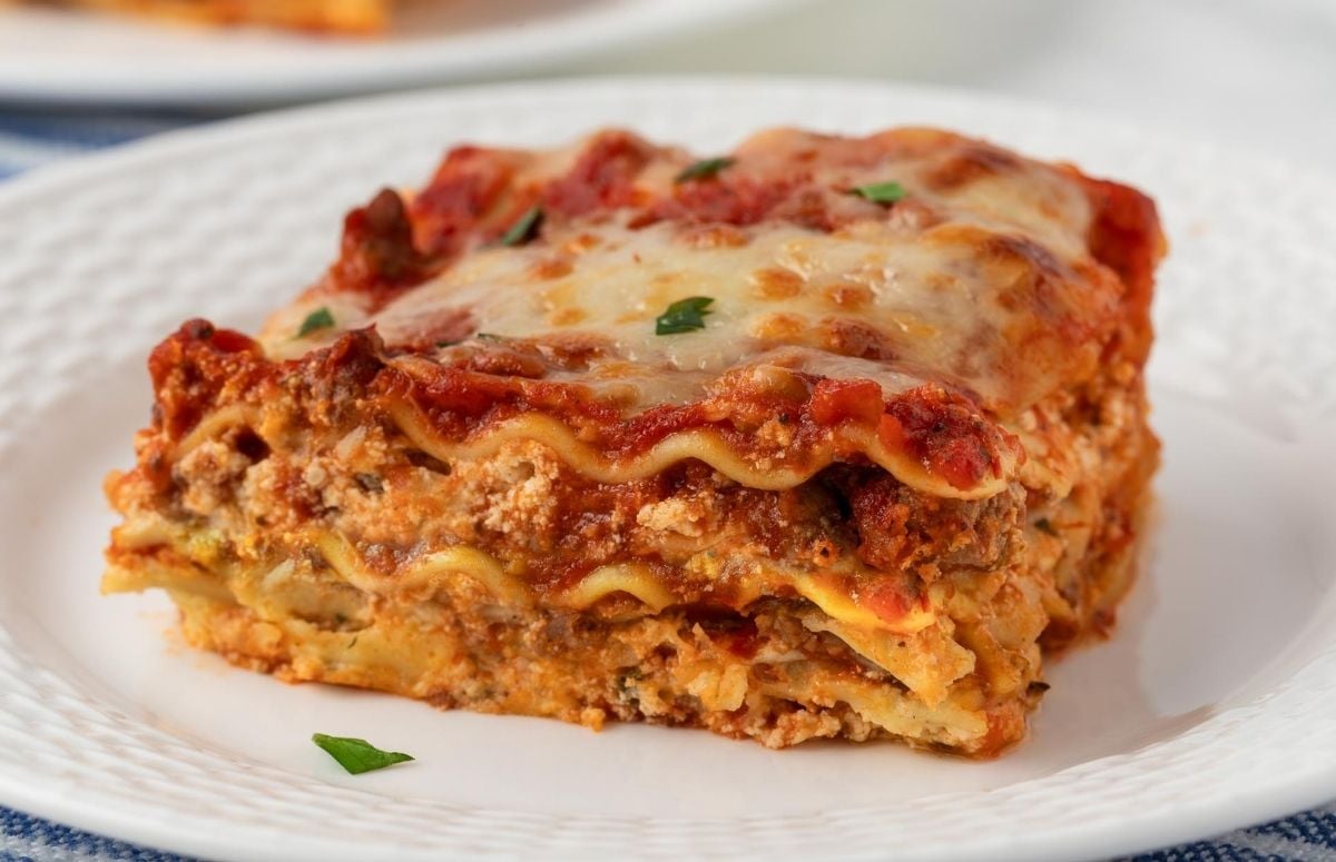 a serving of turkey lasagna in a white dish