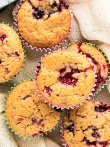 top view of six mixed berry muffins