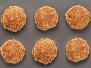 cooking six oatmeal pancakes