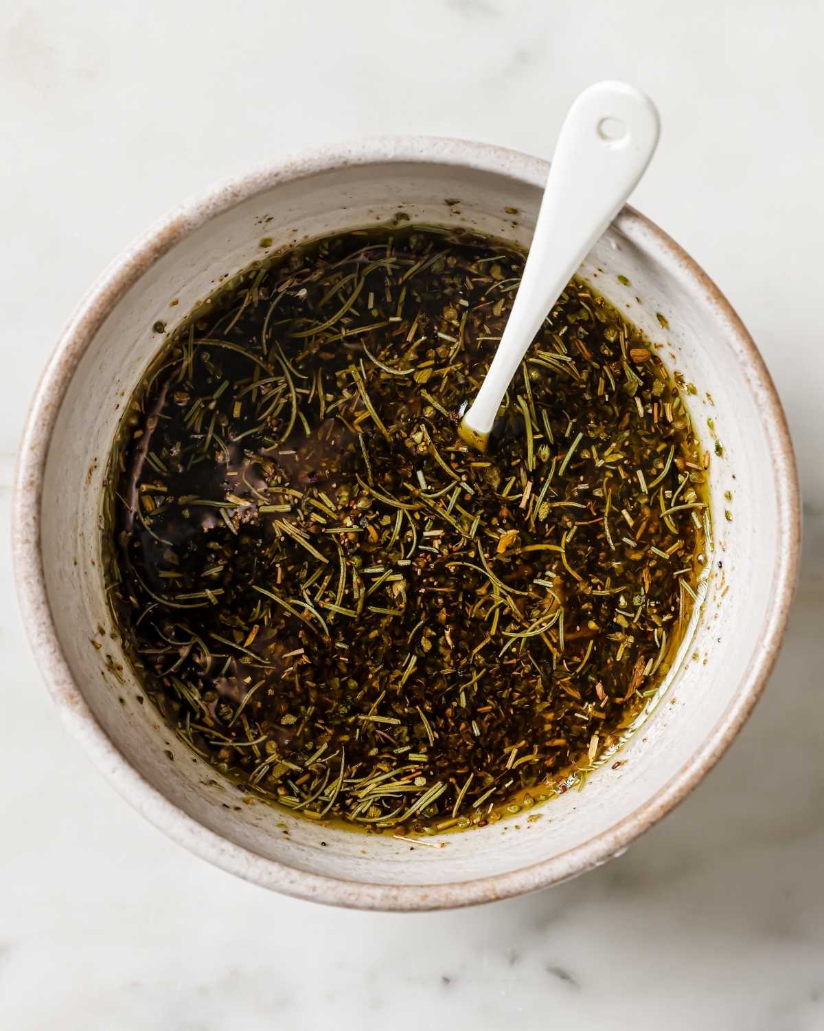 a bowl of spicy marinade for beef kabobs