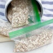 close up of an oat canister with instant oatmeal in zip bags inside and out