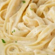 Close-up of fettuccine pasta coated with creamy Alfredo sauce