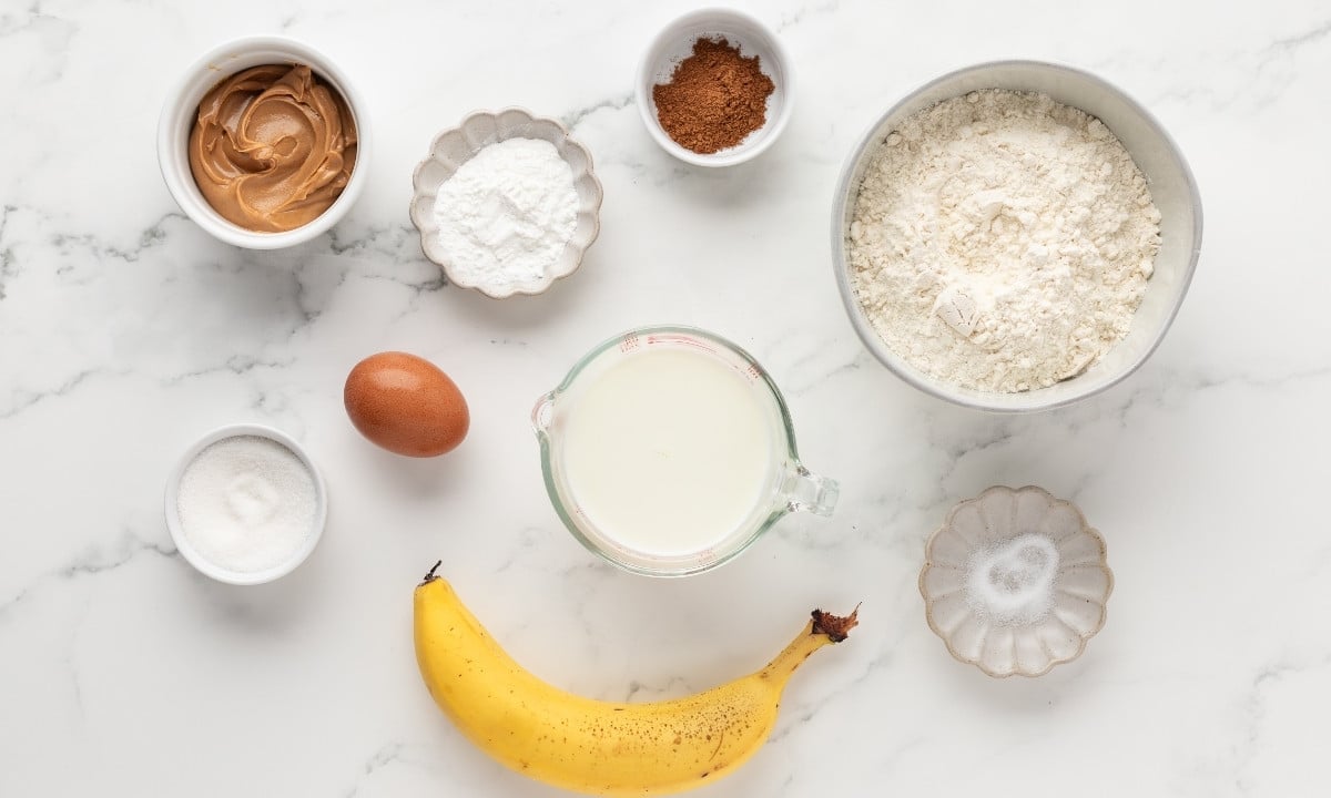overhead view of ingredients to make peanut butter banana pancakes