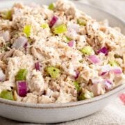 a bowl with cottage cheese tuna salad with chopped red onion and celery