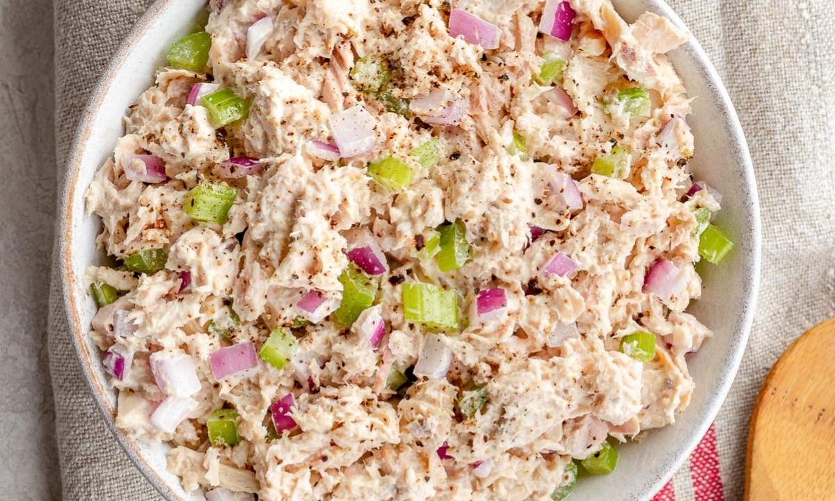 top view of a bowl with cottage cheese tuna salad with chopped red onion and celery