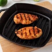 overhead view of buffalo chicken breasts grilled in a pan