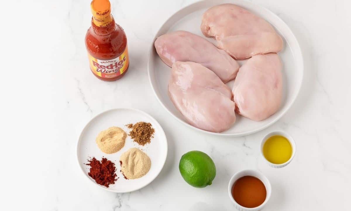 overhead view of ingredients to make grilled buffalo chicken breasts