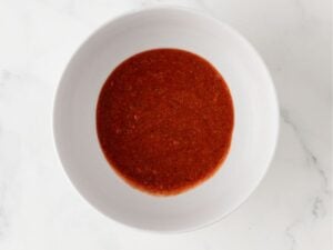 buffalo chicken marinade sauce in a bowl