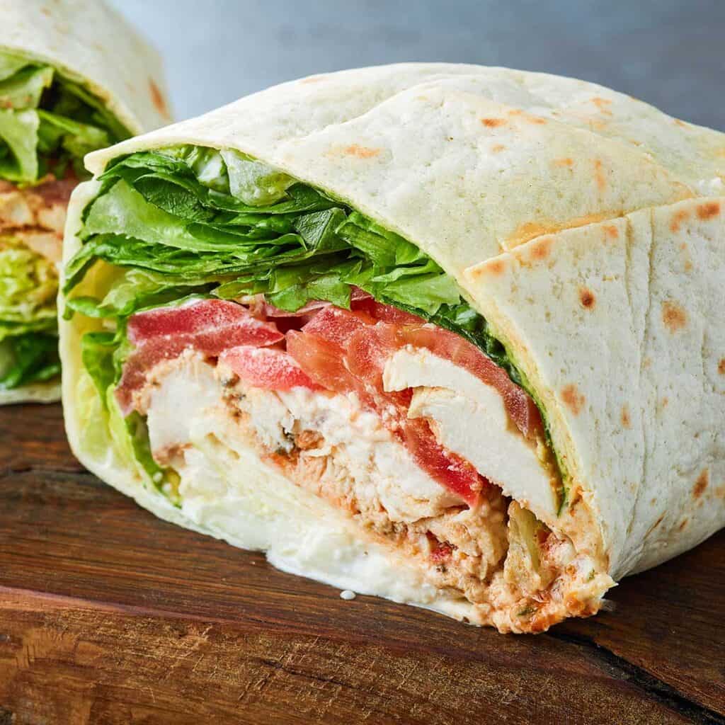 closeup of half BBQ chicken wrap