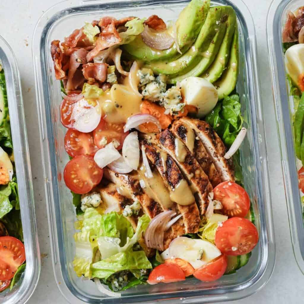 chicken cobb salad in a glass lunch container
