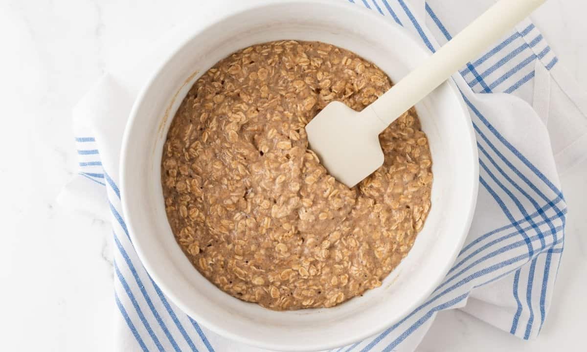 overhead view of the banana oatmeal muffin batter after resting for 10 minutes in a bowl