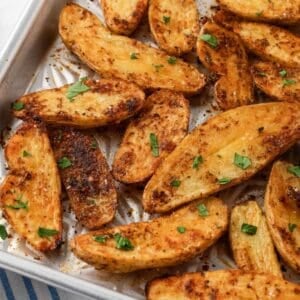 overhead view of roasted fingerling potatoes on a sheet pan