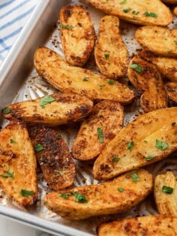 overhead view of roasted fingerling potatoes on a sheet pan