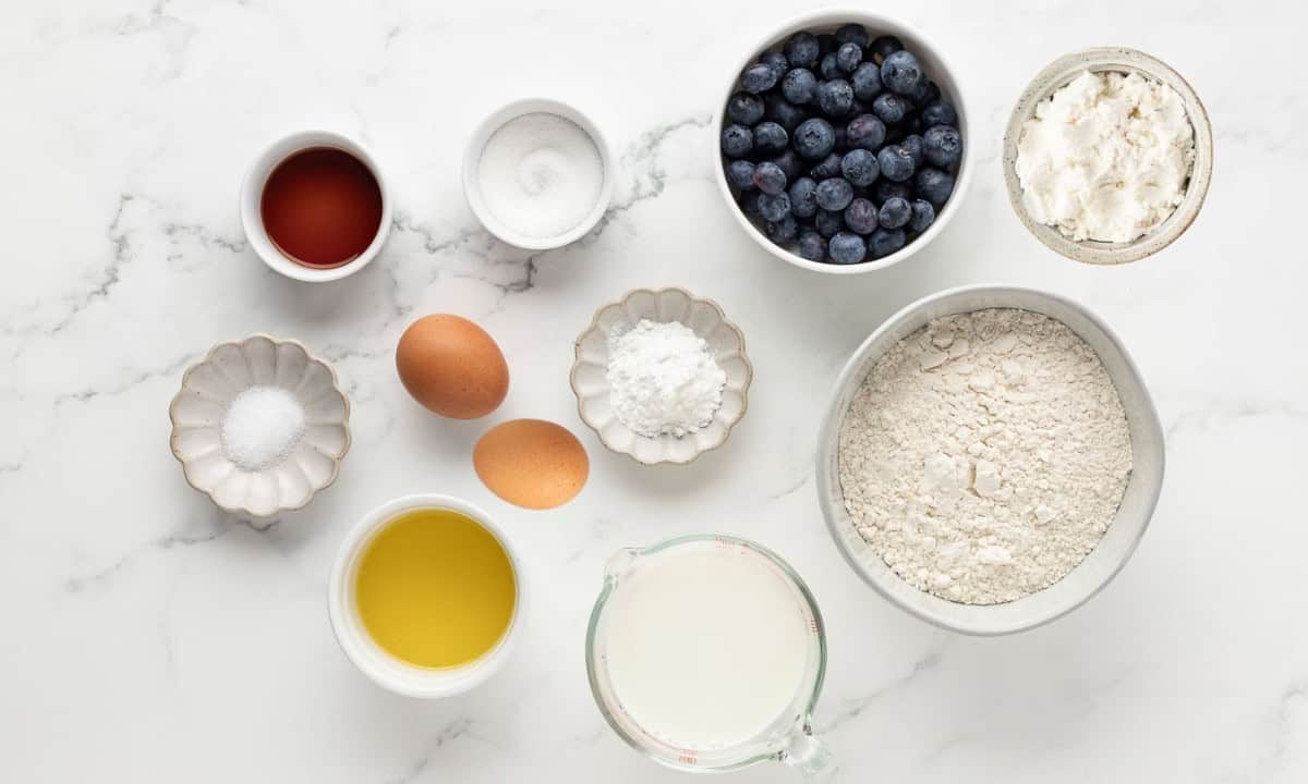 overhead view of ingredients needed to make protein pancakes with blueberries