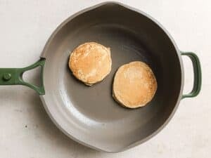 cooking banana pancakes in a pan