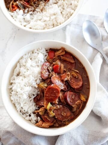 large bowls of chicken sausage gumbo with rice