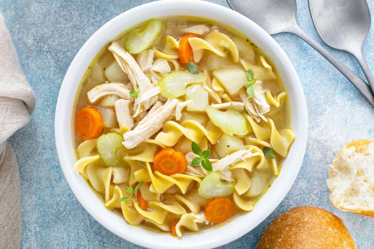 overhead view of a bowl of chicken noodle soup