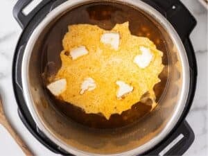 adding the cream cheese and dairy to the instant pot