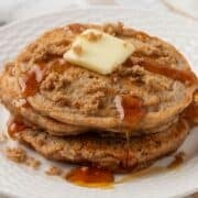a stack of brown sugar pancakes topped with butter and syrup
