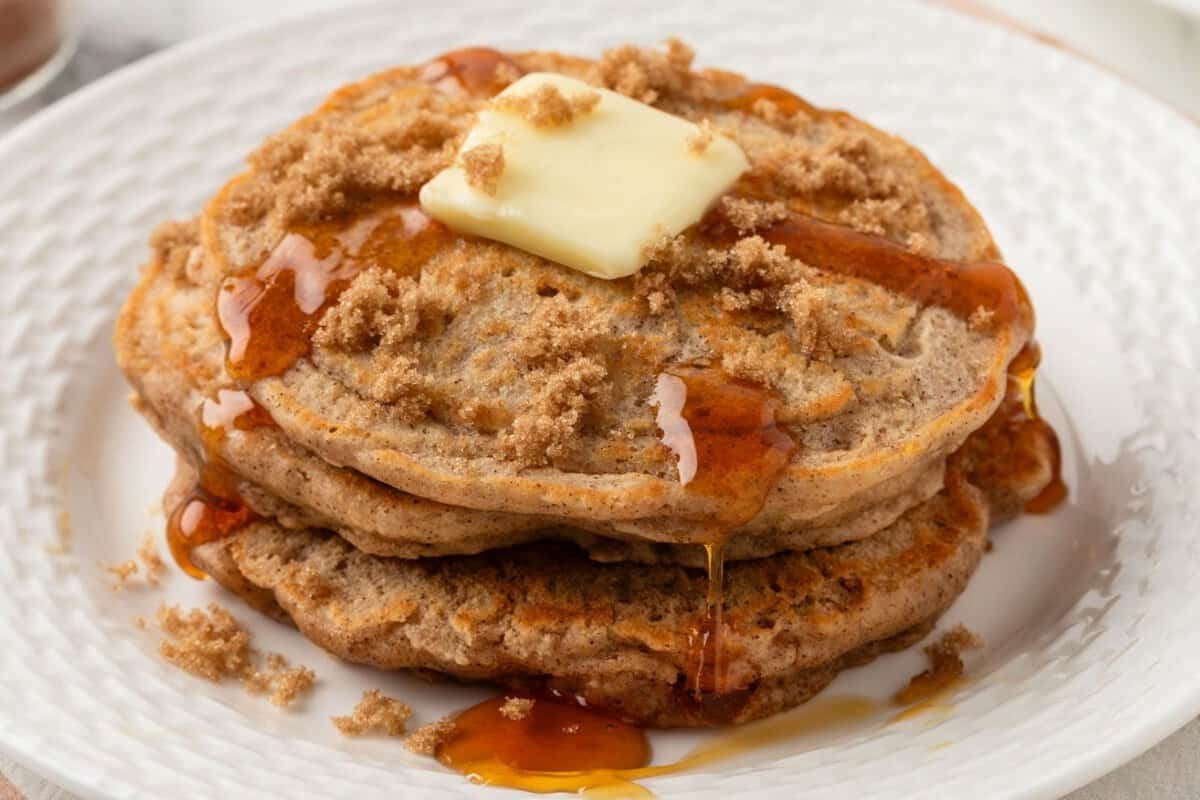 a stack of brown sugar pancakes topped with butter and syrup